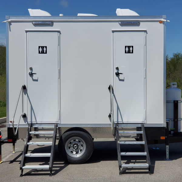 Side view of a 2-station luxury bathroom trailer with two doors and fold-down steps, The Lavatory Los Angeles