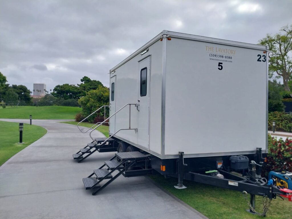 5-station deluxe bathroom trailer set beside a cart path on a golf course, The Lavatory Los Angeles
