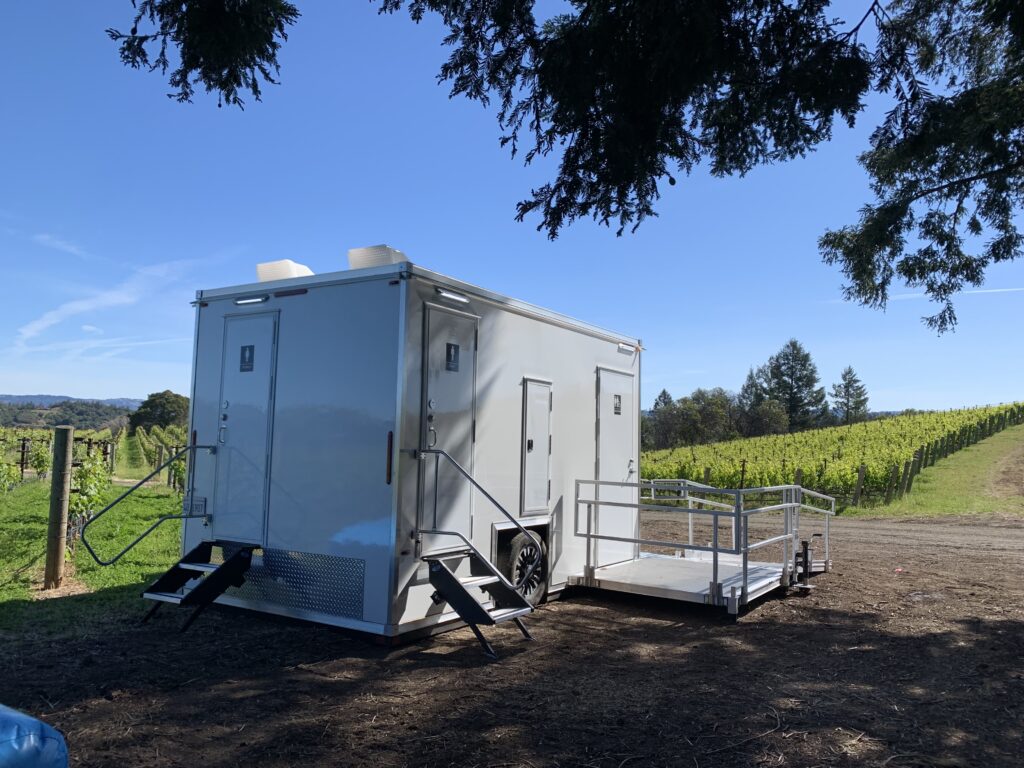 ADA plus 2 bathroom trailer with a ramp platform on a vineyard hillside, The Lavatory Los Angeles