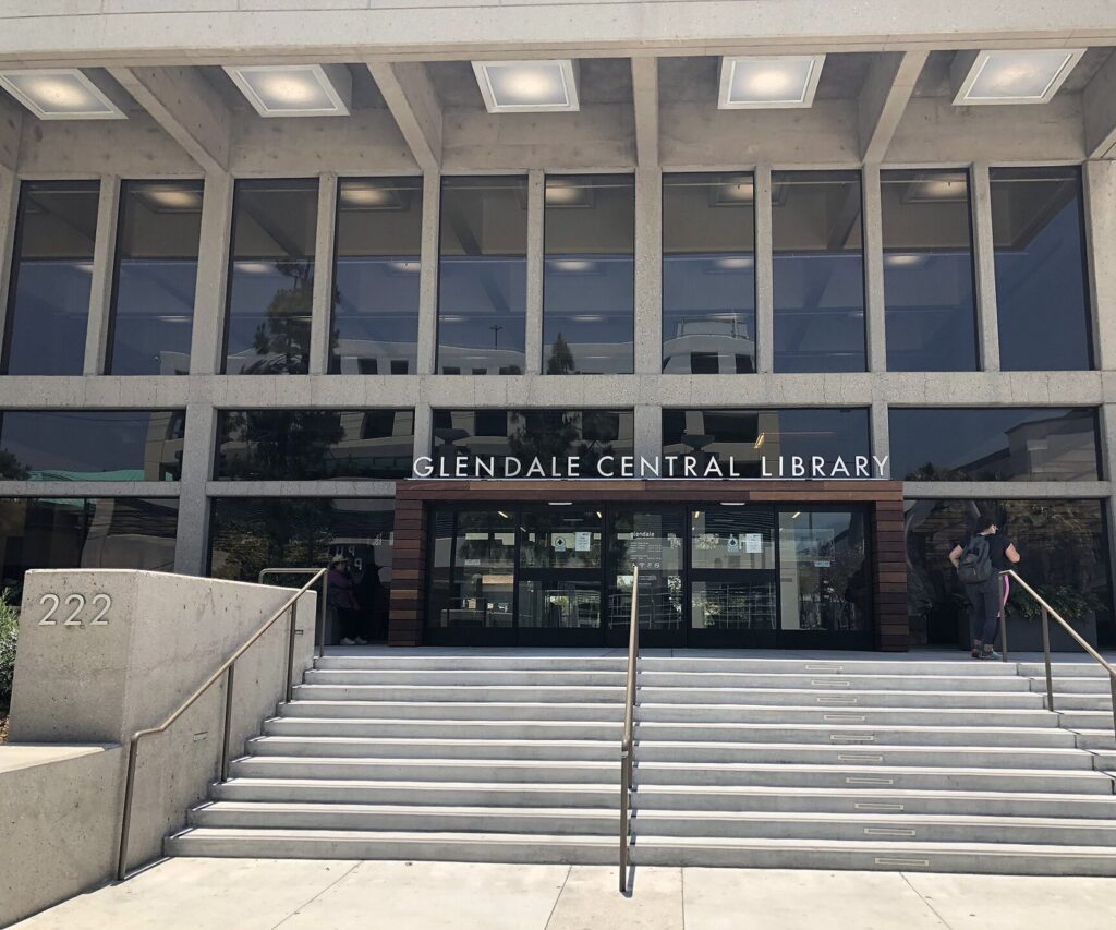 People walking up the front steps of the Glendale Central Library in Glendale, CA, The Lavatory Los Angeles