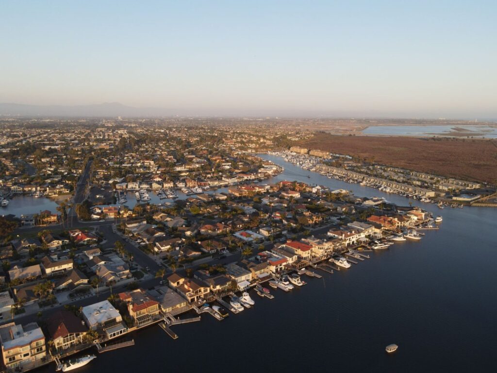 Aerial view of homes, boat docks and channels in north Huntington Beach next to the Bolsa Chica wetlands, The Lavatory Los Angeles