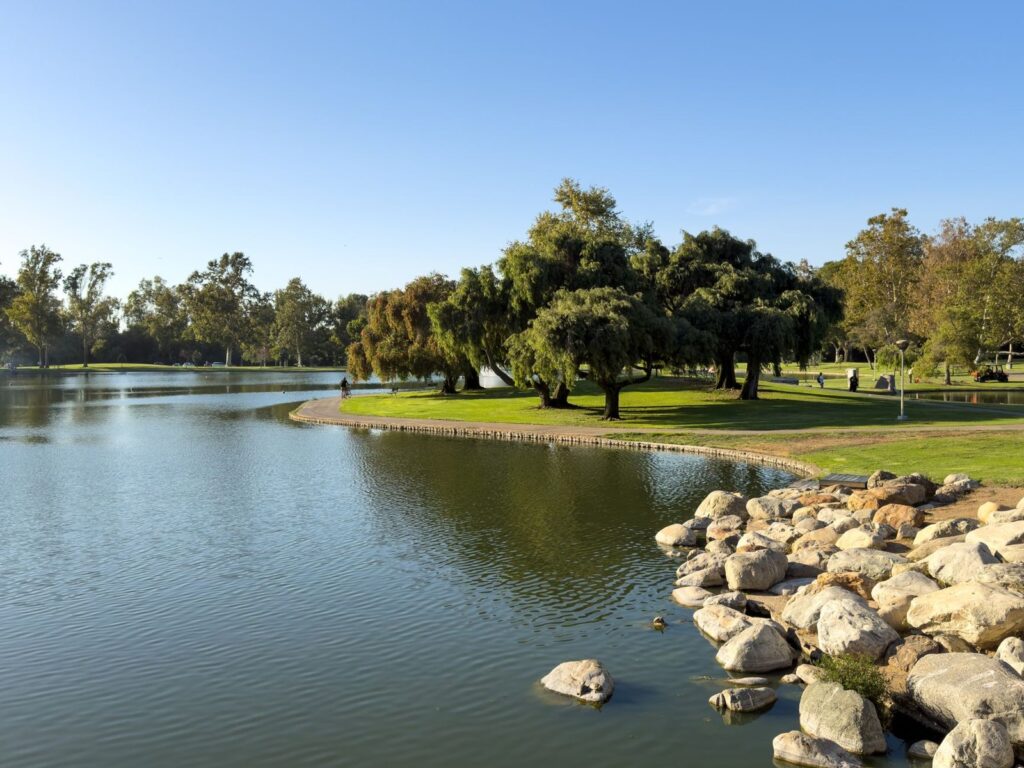 Lake, lawn and shade trees at Bill Barber Park in Irvine, CA, The Lavatory Los Angeles