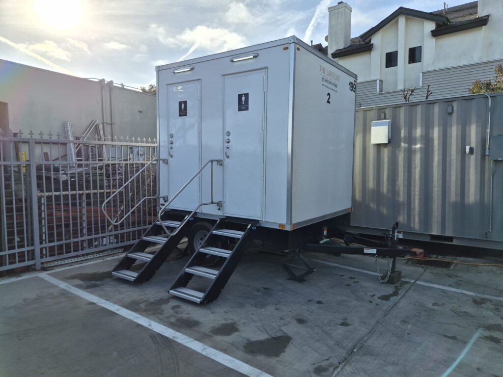 2-station bathroom trailer with fold-down steps on a long-term site in Lawndale, The Lavatory Los Angeles