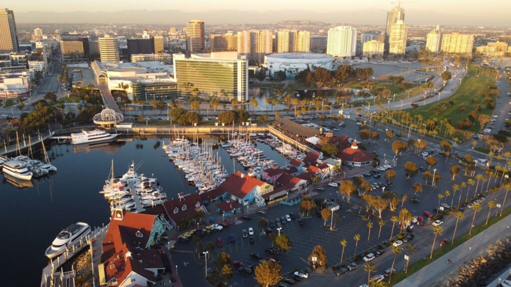 Aerial view of Shoreline Village, its marina and the Long Beach Arena at sunrise, The Lavatory Los Angeles