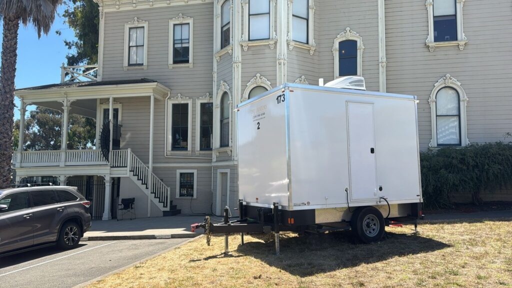 2-station bathroom trailer on the lawn beside a historic Victorian house, The Lavatory Los Angeles