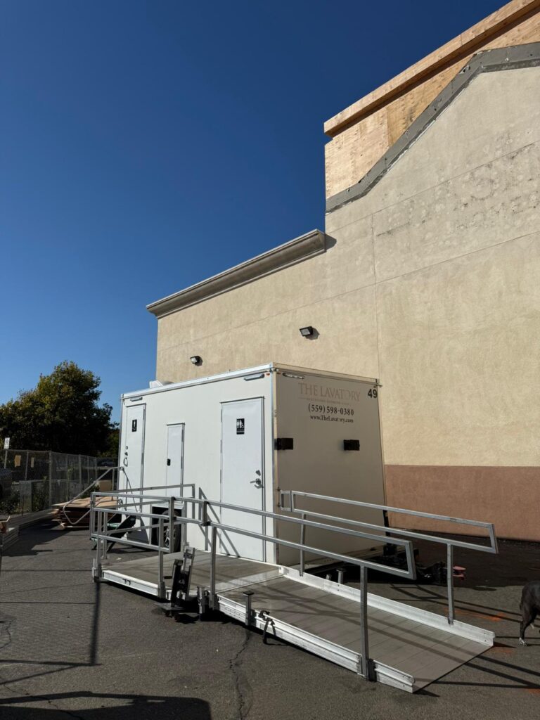 ADA plus 2 bathroom trailer with a long ramp behind a retail building under remodel, The Lavatory Los Angeles