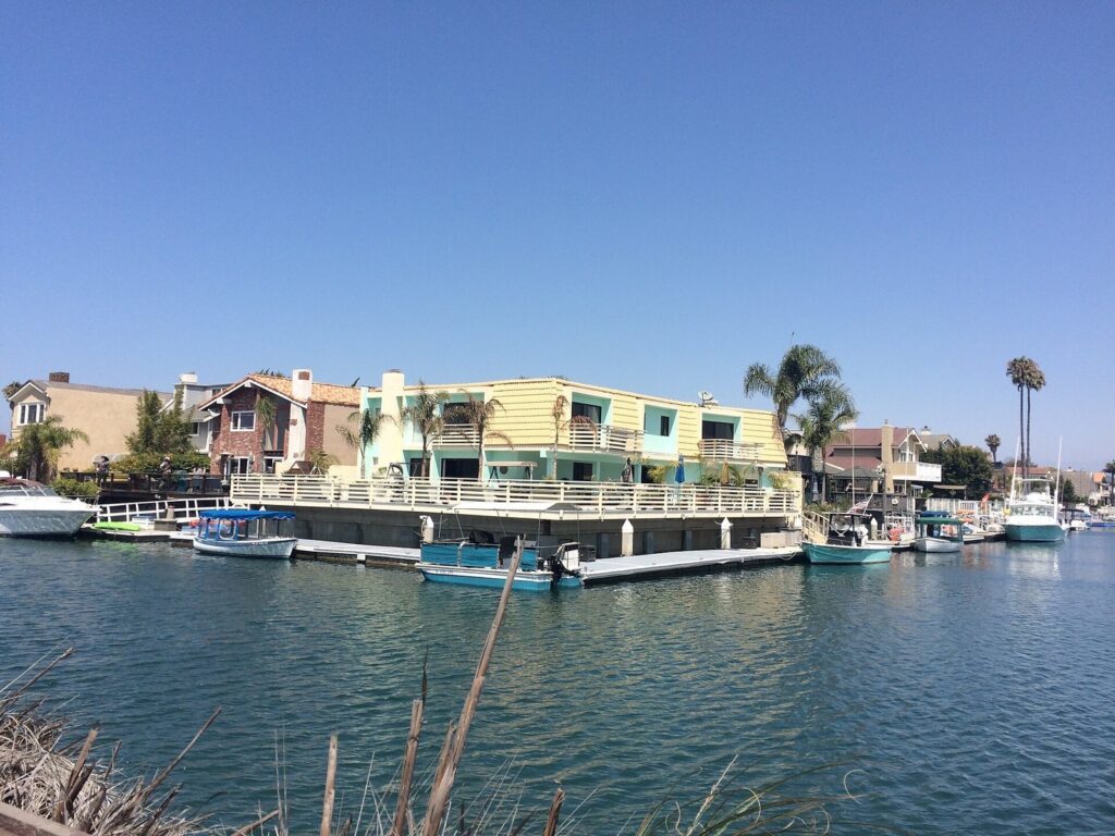 Waterfront homes and boat docks along a channel at Channel Islands Harbor in Oxnard, CA, The Lavatory Los Angeles