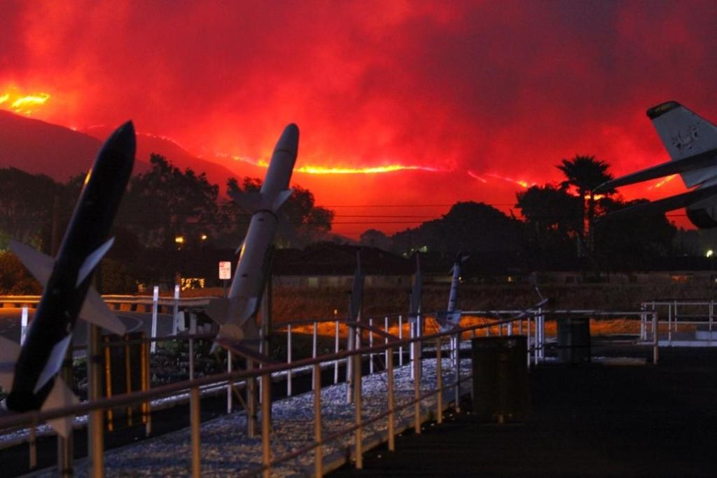 Wildfire glowing red on the hills behind the missile park at Naval Base Ventura County Point Mugu near Oxnard, CA, The Lavatory Los Angeles