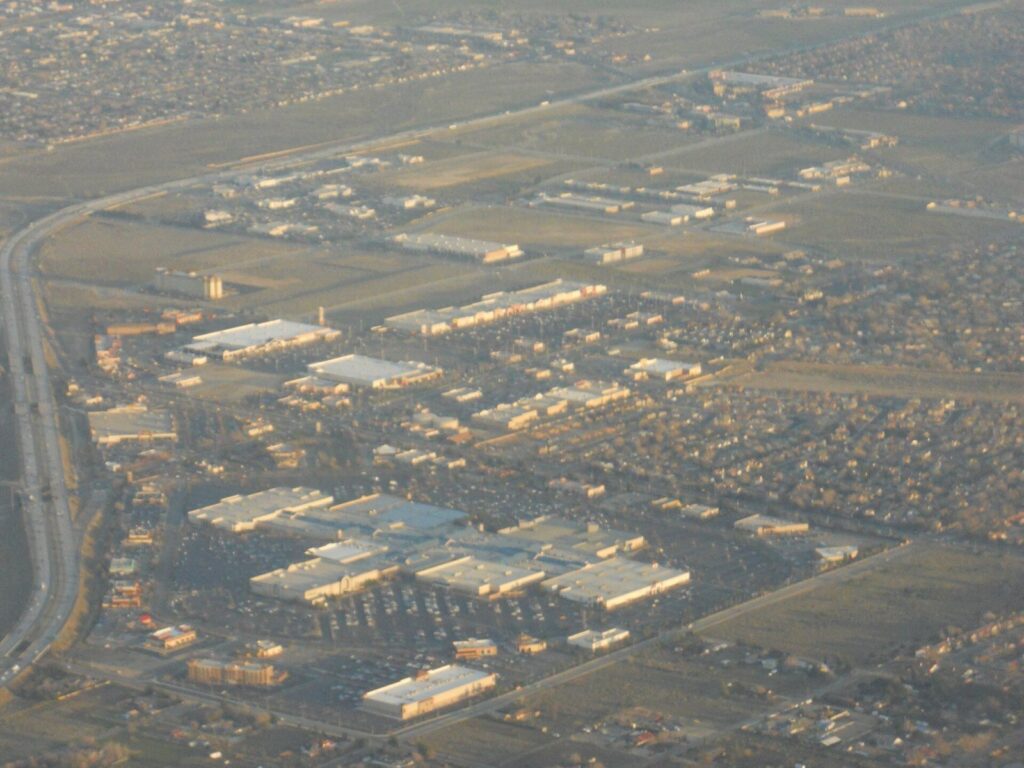 Aerial view of the Antelope Valley Mall area, stores, homes and the 14 Freeway in Palmdale, CA, The Lavatory Los Angeles