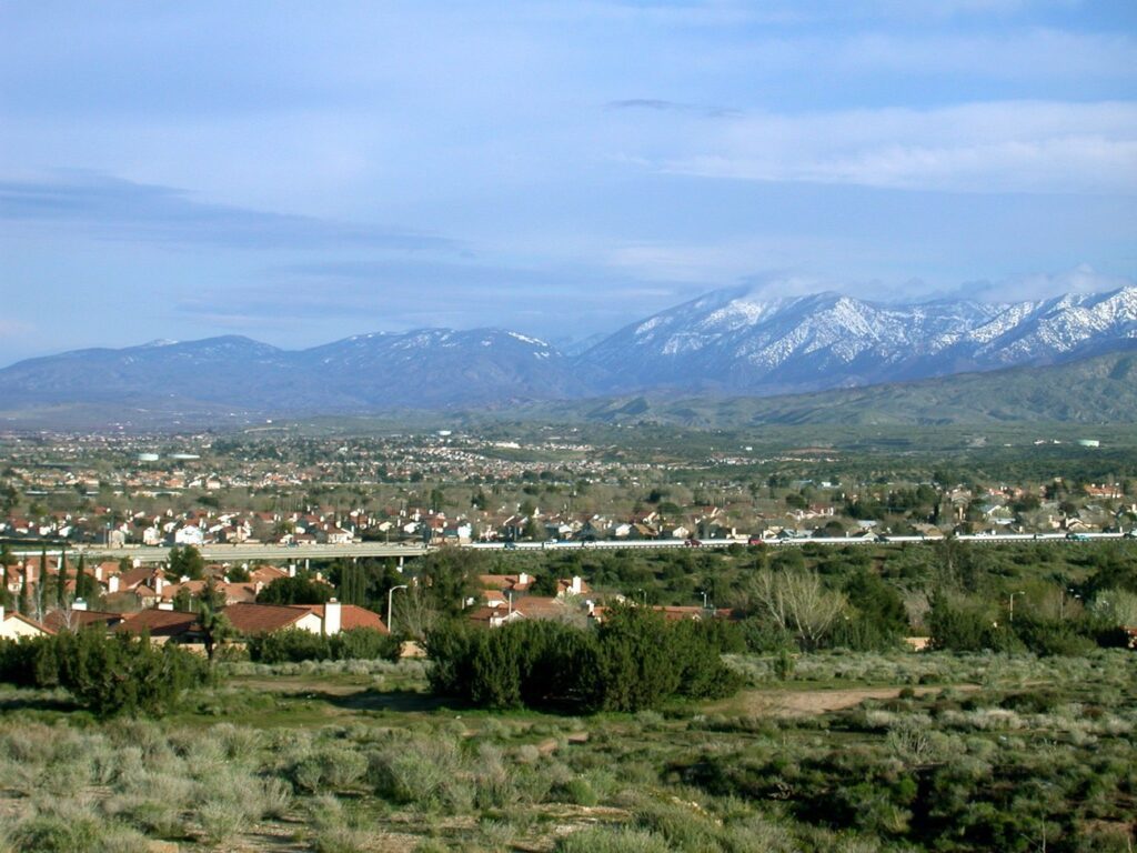 Homes across Palmdale, CA with snow on the San Gabriel Mountains behind the city, The Lavatory Los Angeles