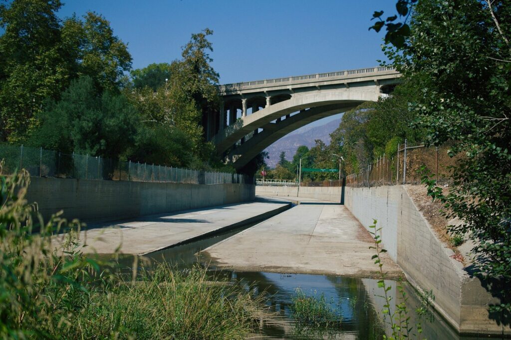 Arroyo Seco channel passing under a concrete arch bridge in the Lower Arroyo, Pasadena, CA, The Lavatory Los Angeles