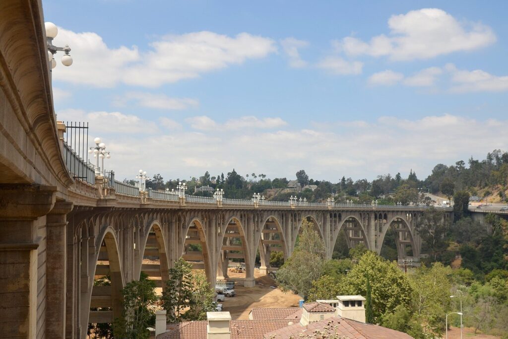 Arched Colorado Street Bridge crossing the Arroyo Seco with homes on the far hillside, Pasadena, CA, The Lavatory Los Angeles