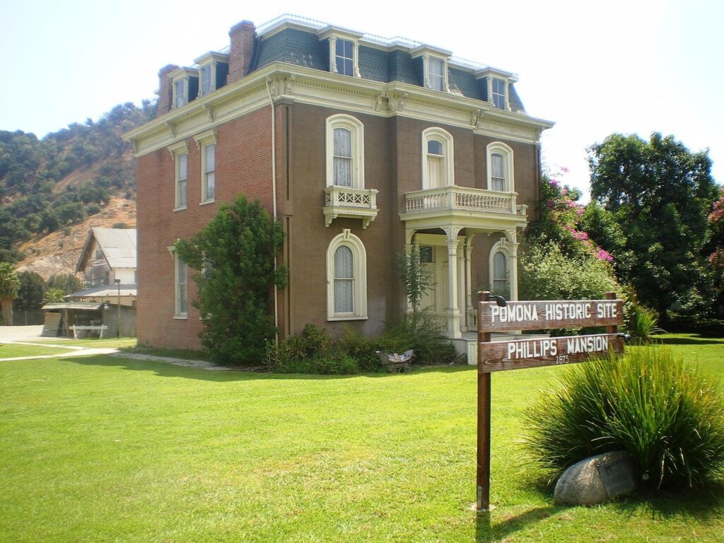 The 1875 Phillips Mansion and its Pomona Historic Site sign on a green lawn in the old Spadra area of Pomona, CA, The Lavatory Los Angeles
