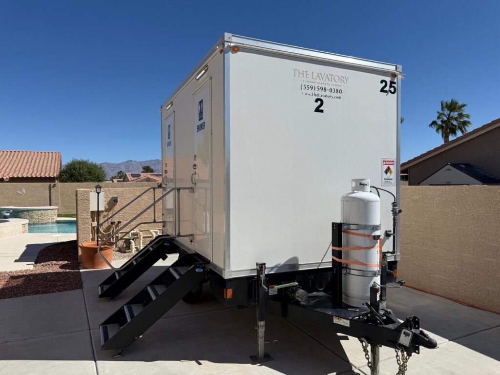 2-station combo trailer on a backyard pool deck with mountains in the distance, The Lavatory Los Angeles