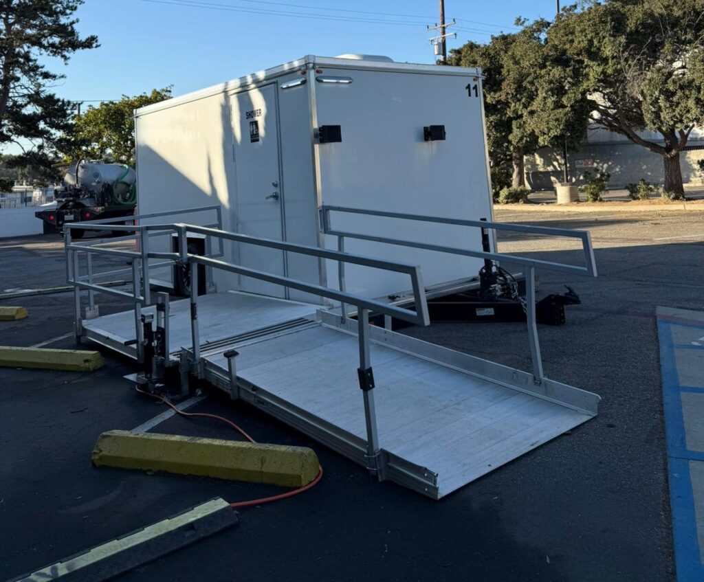 ADA combo shower and bathroom trailer with a railed ramp on a long-term site in Redondo Beach, The Lavatory Los Angeles