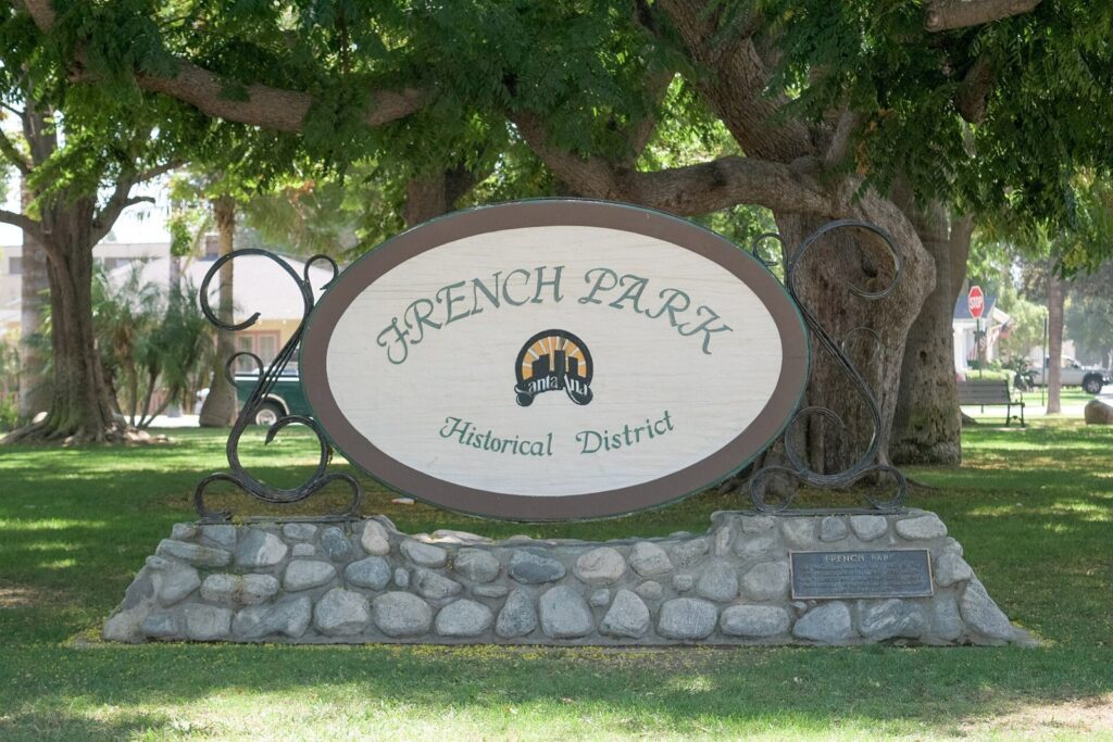 French Park Historical District sign on a lawn under shade trees in Santa Ana, The Lavatory Los Angeles