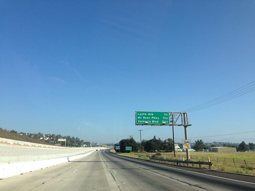 Interstate 5 northbound through Newhall with signs for Lyons Ave, McBean Pkwy and Valencia Blvd, Santa Clarita, CA, The Lavatory Los Angeles