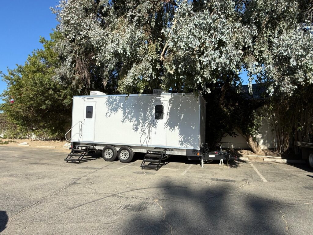 9-station bathroom trailer parked under eucalyptus trees in Santa Monica, The Lavatory Los Angeles